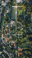 Aerial view of a college campus with sports fields and buildings photo