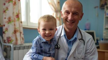 Smiling doctor with happy child patient in a pediatric clinic photo