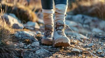 Hiker walking on rugged path with hiking boots photo