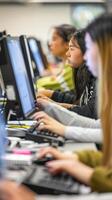 Students working on computers in modern classroom setting photo