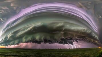 Massive supercell thunderstorm over open field with lightning photo