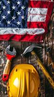 Labor Day Tools and American Flag on Wooden Background photo