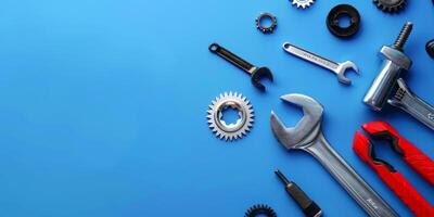 Various tools laid out on blue background photo