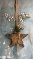 Wooden star with flowers on rustic wall photo