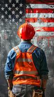 Back view of construction worker facing USA flag, determination photo