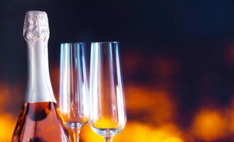 New Year's background with champagne and a glass, for the design of banners for the new year. photo