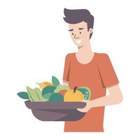 A man holding a bowl of fruit and vegetables vector