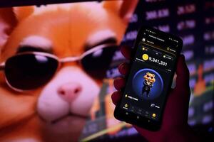 KYIV, UKRAINE - APRIL 20, 2024 Hamster Kombat telegram bot on smartphone screen. Hamster Kombat is a viral Telegram-based crypto game for earn HMSTR tokens by managing virtual crypto exchange photo