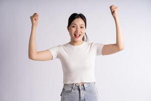 Portrait of beautiful Asian woman posing on white background photo