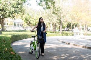 Business Professional Promoting Eco Friendly Transportation and Energy Conservation in Urban Park Setting photo