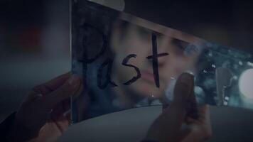 A man gazes at his reflection in glass, contemplating and introspecting about the past video