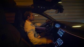 Driving at night in a luxurious car featuring a highly modern and sophisticated dashboard video