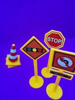 Toy traffic sign on a blue background photo