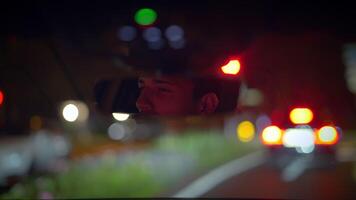 Reflecting on the experience of a nighttime drive while observing the rearview mirror closely video