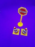 Toy traffic sign on a blue background photo