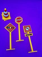 Toy traffic sign on a blue background photo