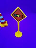Toy traffic sign on a blue background photo