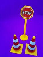 Toy traffic sign on a blue background photo