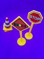 Toy traffic sign on a blue background photo