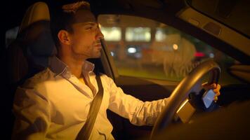 A Nighttime Drive A Single Man Navigating Through the City in a Modern and Stylish Vehicle video