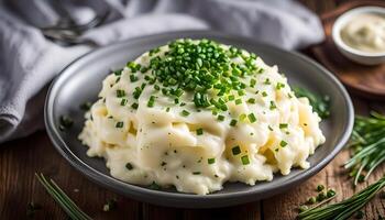 Mashed potato topped with chives photo