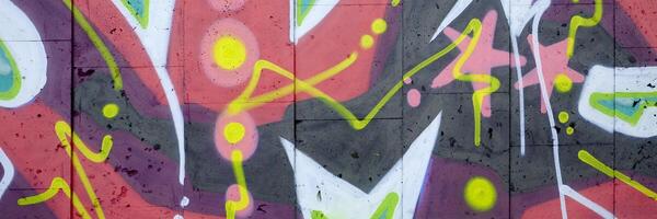 Colorful background of graffiti painting artwork with bright aerosol outlines on wall. Old school street art piece made with aerosol spray paint cans. Contemporary youth culture photo
