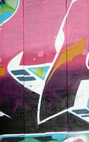 Colorful background of graffiti painting artwork with bright aerosol outlines on wall. Old school street art piece made with aerosol spray paint cans. Contemporary youth culture photo