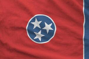 Tennessee US state flag depicted on folded wavy fabric of old cloth photo