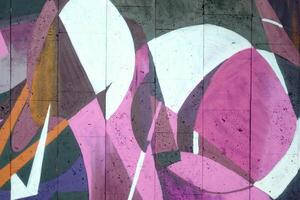 Colorful background of graffiti painting artwork with bright aerosol outlines on wall. Old school street art piece made with aerosol spray paint cans. Contemporary youth culture photo