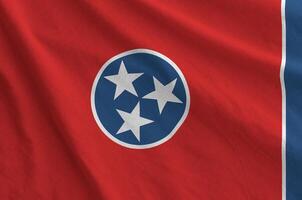 Tennessee US state flag depicted on folded wavy fabric of old cloth photo