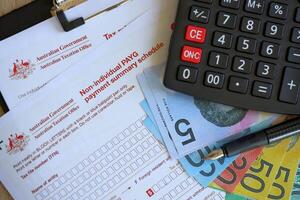 KYIV, UKRAINE - JULY 10, 2024 Australian Non-Individual PAYG payment summary schedule blank form lies on table of Australian Government taxation office photo