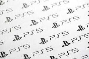 KYIV, UKRAINE - JUNE 26, 2024 Sony Playstation 5 console logo repeating many times on white paper background banner photo