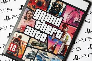 KYIV, UKRAINE - JUNE 26, 2024 Grand Theft Auto 6 PS5 game disc box for console gaming. Fictional fan-made game disc pack cover photo