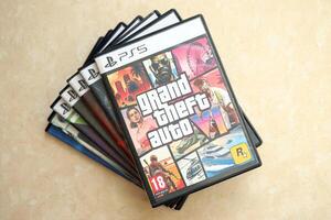 KYIV, UKRAINE - JUNE 26, 2024 Grand Theft Auto 6 PS5 game disc box for console gaming. Fictional fan-made game disc pack cover photo
