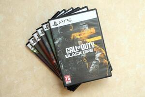 KYIV, UKRAINE - JUNE 26, 2024 Call of Duty Black Ops 6 PS5 game disc box for console gaming. Popular game disc photo