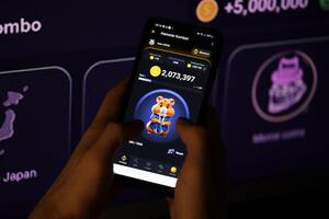 KYIV, UKRAINE - APRIL 20, 2024 Hamster Kombat telegram bot on smartphone screen. Hamster Kombat is a viral Telegram-based crypto game for earn HMSTR tokens by managing virtual crypto exchange photo