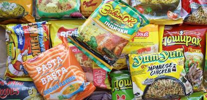 KYIV, UKRAINE - APRIL 20, 2024 Many packs of instant noodles for fast cooking by various brands and manufacturers photo