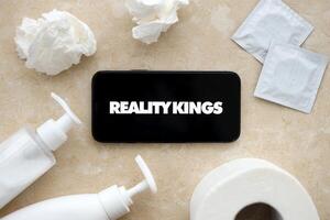 KYIV, UKRAINE - JANUARY 23, 2024 RealityKings adult content website logo on display of iPhone 12 Pro photo
