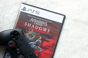 KYIV, UKRAINE - JUNE 26, 2024 Assassin's Creed Shadows PS5 game disc box for console gaming. Popular game disc photo