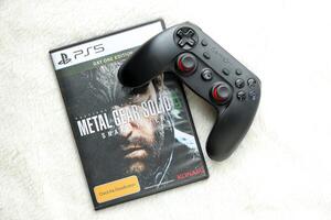 KYIV, UKRAINE - JUNE 26, 2024 Metal Gear Solid Delta Snake Eater PS5 game disc box for console gaming. Popular game disc photo