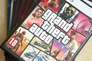 KYIV, UKRAINE - JUNE 26, 2024 Grand Theft Auto 6 PS5 game disc box for console gaming. Fictional fan-made game disc pack cover photo