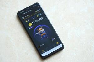 KYIV, UKRAINE - APRIL 20, 2024 Hamster Kombat telegram bot on smartphone screen. Hamster Kombat is a viral Telegram crypto game for earn HMSTR tokens by managing virtual crypto exchange photo