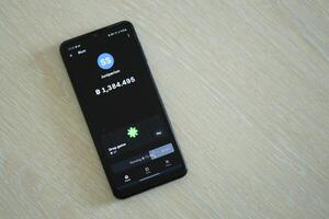 KYIV, UKRAINE - APRIL 20, 2024 Blum telegram bot on smartphone screen. Blum is a viral Telegram based crypto game for earn tokens by managing virtual crypto exchange photo