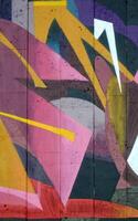Colorful background of graffiti painting artwork with bright aerosol outlines on wall. Old school street art piece made with aerosol spray paint cans. Contemporary youth culture photo