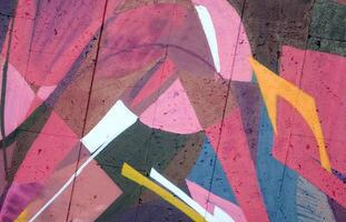 Colorful background of graffiti painting artwork with bright aerosol outlines on wall. Old school street art piece made with aerosol spray paint cans. Contemporary youth culture photo
