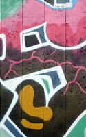 Colorful background of graffiti painting artwork with bright aerosol outlines on wall. Old school street art piece made with aerosol spray paint cans. Contemporary youth culture photo