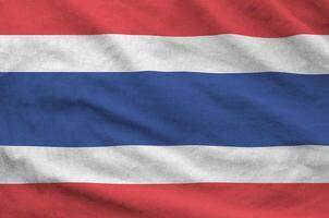 Thailand flag depicted on folded wavy fabric of old cloth photo