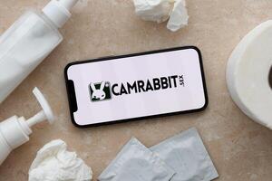 KYIV, UKRAINE - JANUARY 23, 2024 CamRabbit adult content website logo on display of iPhone 12 Pro photo