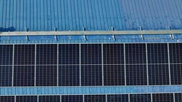 Worker Technicians are working to construct solar panels system on roof. Installing solar photovoltaic panel system. Men technicians carrying photovoltaic solar modules on roof. video