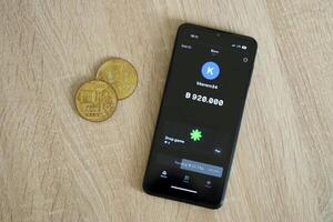 KYIV, UKRAINE - APRIL 20, 2024 Blum telegram bot on smartphone screen. Blum is a viral Telegram based crypto game for earn tokens by managing virtual crypto exchange photo